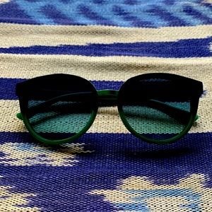 Tory Burch dual colored blue and green tortoise shell glasses.
